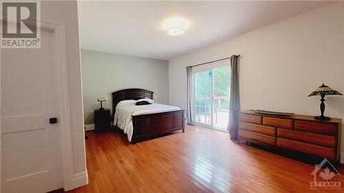 Extremely spacious Primary Bedroom with Patio - 653 Bayview Drive, Constance Bay, ON - Indoor Photo Showing Bedroom