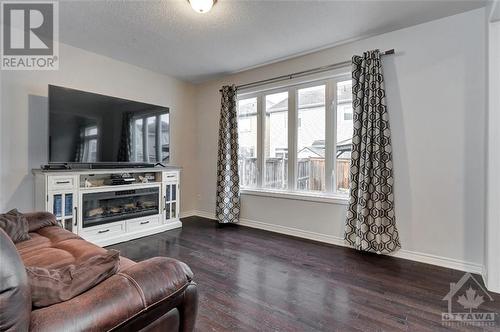 537 Sunlit Circle, Ottawa, ON - Indoor Photo Showing Living Room With Fireplace