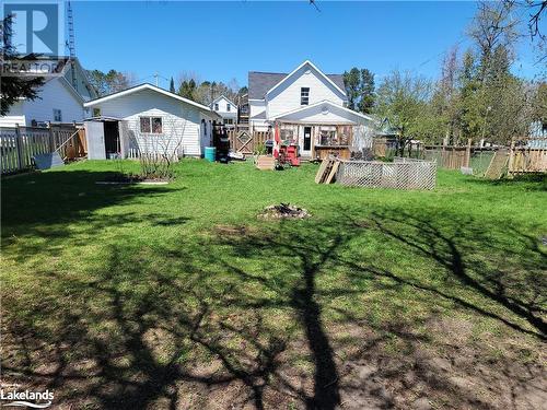 Backyard View To House & Detached Insulated Garage With Hydro - 13 Main Street, Sundridge, ON - Outdoor With Deck Patio Veranda