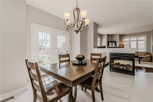 60 Springbreeze Heights, Hamilton, ON - Indoor Photo Showing Dining Room With Fireplace