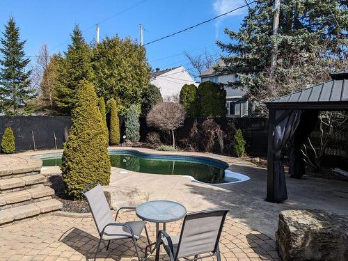 Backyard - 2595 Rue Des Pintades, Laval (Sainte-Rose), QC - Outdoor With In Ground Pool With Deck Patio Veranda