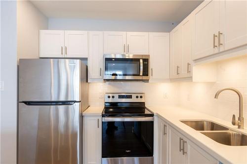 112 St. Joseph'S Drive|Unit #202, Hamilton, ON - Indoor Photo Showing Kitchen With Stainless Steel Kitchen With Double Sink With Upgraded Kitchen