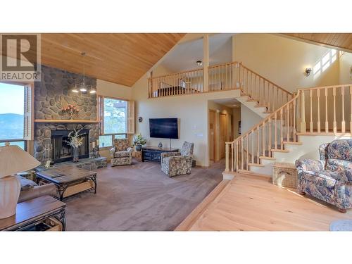 6488 Farmers Drive, Kelowna, BC - Indoor Photo Showing Living Room With Fireplace