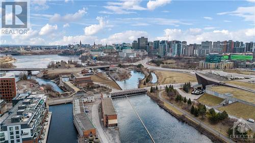 At Zibi, peacefull waterways are never far away. A 10 minute waterfront stroll bring you to Mill Street Brew Pub. - 320 Miwate Private Unit#207, Ottawa, ON - Outdoor With View