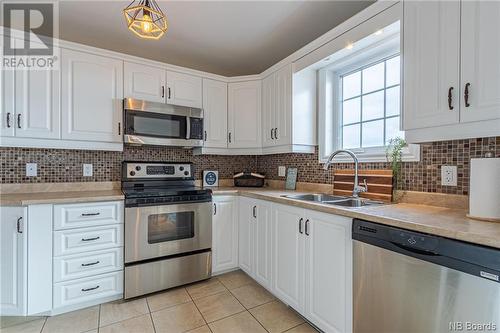 657 Baie, Beresford, NB - Indoor Photo Showing Kitchen With Double Sink