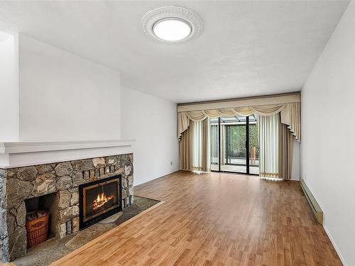 18-4140 Interurban Rd, Saanich, BC - Indoor Photo Showing Living Room With Fireplace