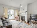 102-5685 Edgewater Lane, Nanaimo, BC  - Indoor Photo Showing Living Room With Fireplace 