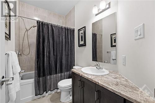 Main level full bathroom with bathtub and tiled wall - 701 Du Rivage Street, Rockland, ON - Indoor Photo Showing Bathroom