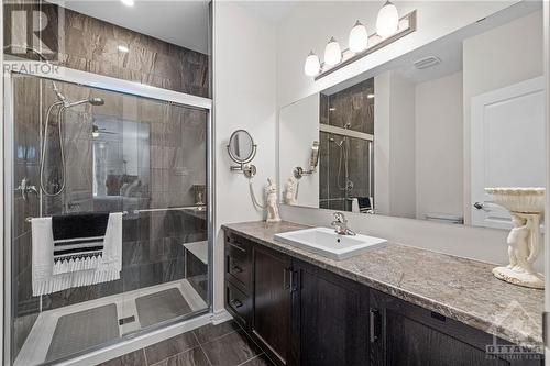 Ensuite with tiled shower featuring a built-in bench and lots of counter space! - 701 Du Rivage Street, Rockland, ON - Indoor Photo Showing Bathroom