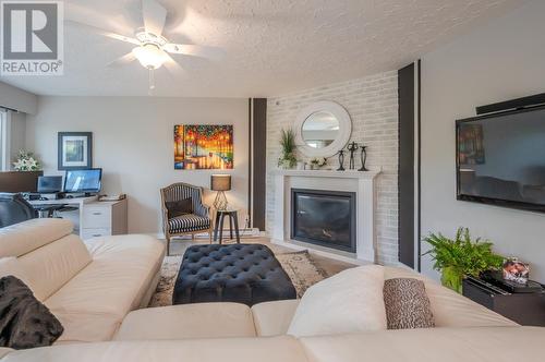 22 Abbott Street Unit# 104, Penticton, BC - Indoor Photo Showing Living Room With Fireplace