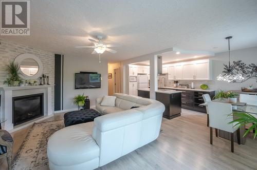 22 Abbott Street Unit# 104, Penticton, BC - Indoor Photo Showing Living Room With Fireplace