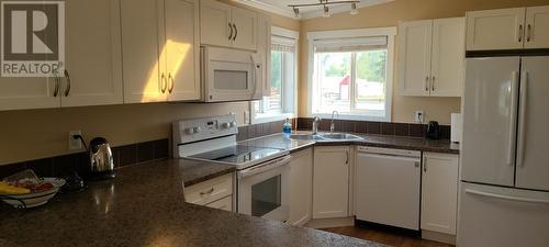 72 Tomkinson Road, Grindrod, BC - Indoor Photo Showing Kitchen With Double Sink