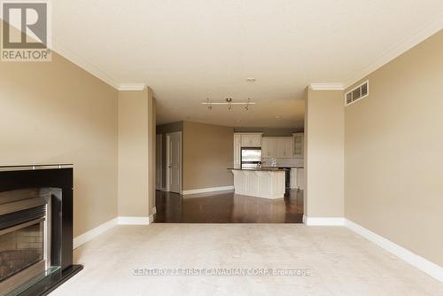 #707 -250 Pall Mall St, London, ON - Indoor With Fireplace