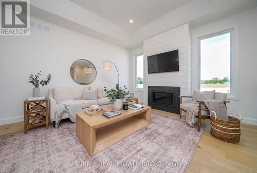 #55 -2 Coastal Cres, Lambton Shores, ON - Indoor Photo Showing Living Room With Fireplace