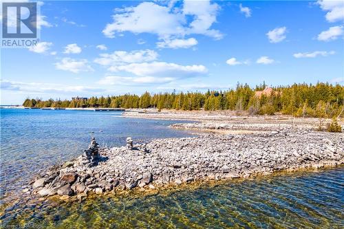 Clean rocky shoreline at the public water access - 128 Little Pine Drive, Northern Bruce Peninsula, ON 