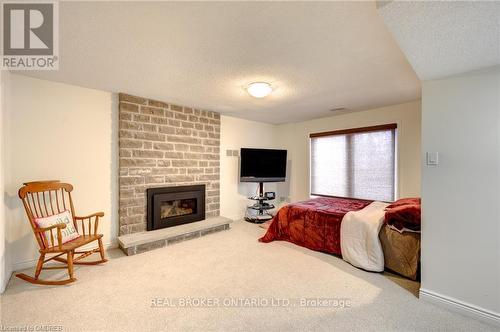 1394 Hazelton Blvd, Burlington, ON - Indoor Photo Showing Bedroom With Fireplace
