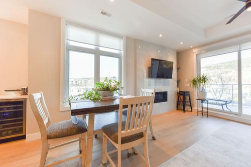 101-222 Lee Avenue, Penticton, BC - Indoor Photo Showing Dining Room With Fireplace