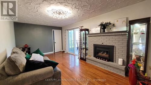 568 Canewood Crescent, Waterloo, ON - Indoor Photo Showing Living Room With Fireplace