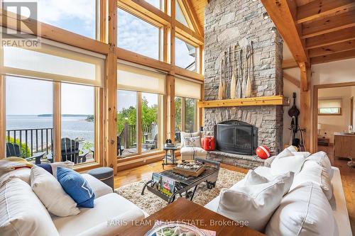 220 Kamenni Bay Rd, Georgian Bay, ON - Indoor Photo Showing Living Room With Fireplace