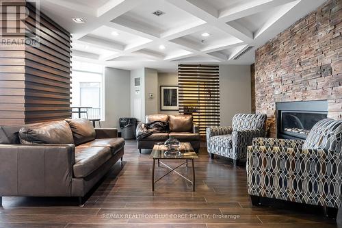 409 - 1235 Bayly Street, Pickering, ON - Indoor Photo Showing Living Room With Fireplace