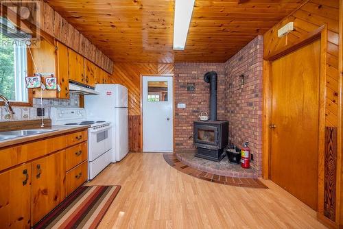 419 Devlin Lane, Laurentian Hills, ON - Indoor Photo Showing Kitchen With Fireplace