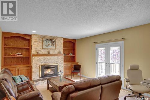 2758 Kliman Crescent, Regina, SK - Indoor Photo Showing Living Room With Fireplace