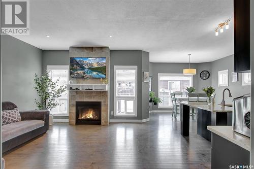 5447 Universal Crescent, Regina, SK - Indoor Photo Showing Living Room With Fireplace