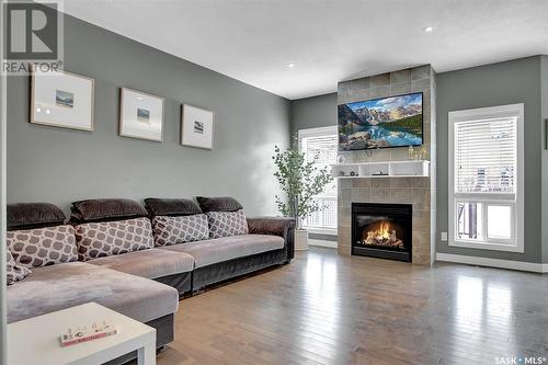 5447 Universal Crescent, Regina, SK - Indoor Photo Showing Living Room With Fireplace