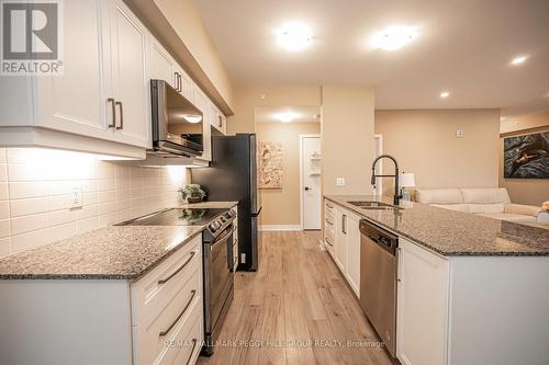 #617 -4 Spice Way, Barrie, ON - Indoor Photo Showing Kitchen With Double Sink With Upgraded Kitchen