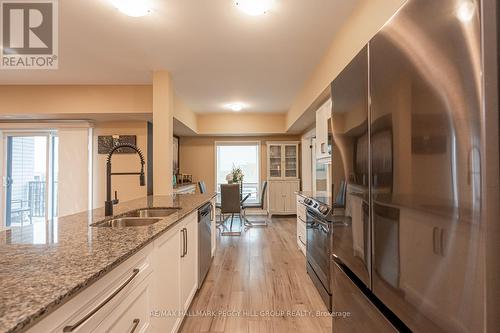 #617 -4 Spice Way, Barrie, ON - Indoor Photo Showing Kitchen With Double Sink