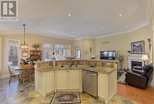 158 Legendary Tr, Whitchurch-Stouffville, ON - Indoor Photo Showing Kitchen With Fireplace With Double Sink