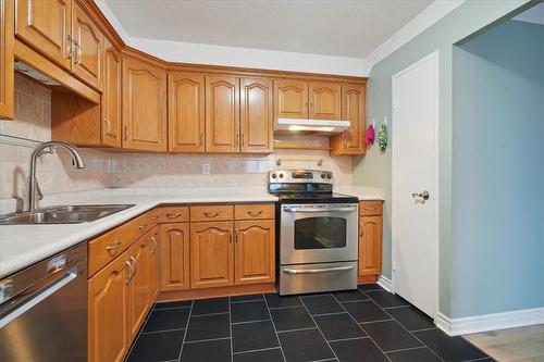 301 Frances Avenue|Unit #404, Stoney Creek, ON - Indoor Photo Showing Kitchen With Double Sink