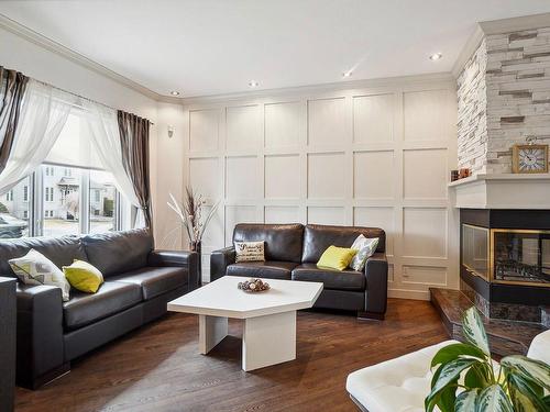 Salon - 228 Rue Des Bois-Francs, Repentigny (Repentigny), QC - Indoor Photo Showing Living Room With Fireplace