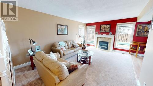 10826 102 Street, Fort St. John, BC - Indoor Photo Showing Living Room With Fireplace