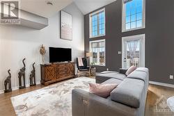 Main level living room features cathedral ceilings - 