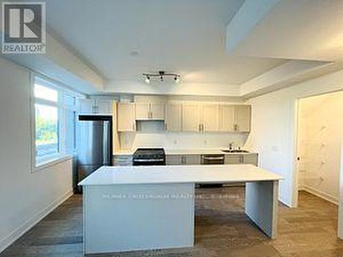 250 - 1075 Douglas Mccurdy Comm Court, Mississauga, ON - Indoor Photo Showing Kitchen With Double Sink