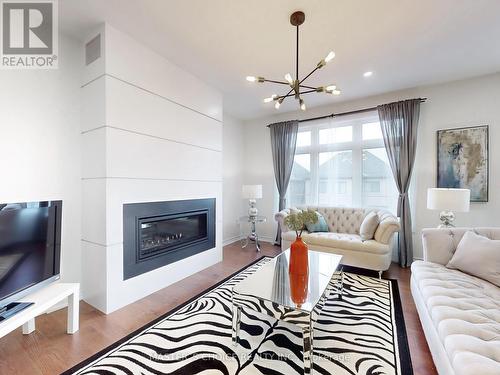 68 Kentledge Avenue, East Gwillimbury, ON - Indoor Photo Showing Living Room With Fireplace