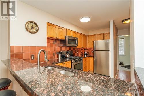 108 Centrepointe Drive Unit#I, Nepean, ON - Indoor Photo Showing Kitchen With Double Sink With Upgraded Kitchen