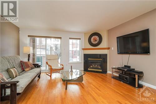 108 Centrepointe Drive Unit#I, Nepean, ON - Indoor Photo Showing Living Room With Fireplace