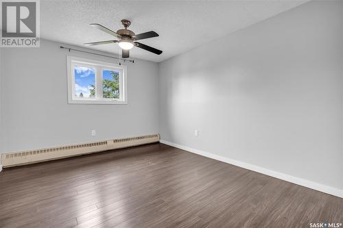 204 2931 Harding Street, Regina, SK - Indoor Photo Showing Living Room With Fireplace