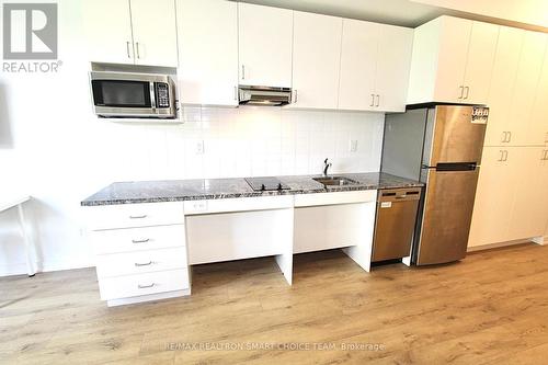 303 - 1800 Simcoe Street N, Oshawa, ON - Indoor Photo Showing Kitchen With Stainless Steel Kitchen