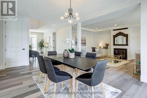 115 Villeneuve Drive, Prince Edward County, ON - Indoor Photo Showing Dining Room With Fireplace