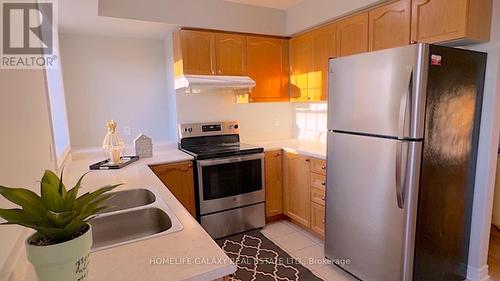 #421 -7428 Markham Rd, Markham, ON - Indoor Photo Showing Kitchen With Double Sink