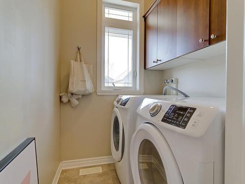 Salle de lavage - 35 Rue De Syracuse, Candiac, QC - Indoor Photo Showing Laundry Room