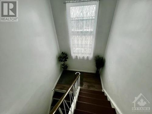 stairway with large window - 1159 Maitland Avenue, Ottawa, ON - Indoor Photo Showing Other Room