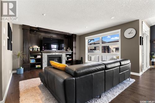3510 Green Marsh Crescent, Regina, SK - Indoor Photo Showing Living Room With Fireplace