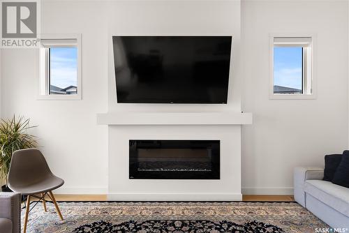 5448 Boyer Bay, Regina, SK - Indoor Photo Showing Living Room With Fireplace