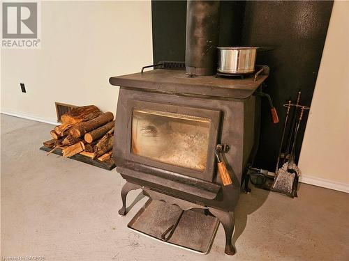 Considered the most efficient woodstove - the Blaze King, Princess catalytic Model. - 439021 Lakeshore Drive, Annan, ON - Indoor With Fireplace