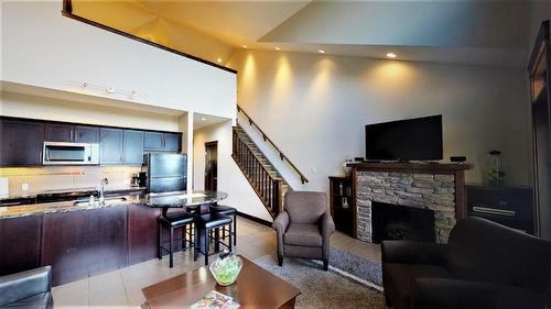 735 C - 700 Bighorn Boulevard, Radium Hot Springs, BC - Indoor Photo Showing Living Room With Fireplace