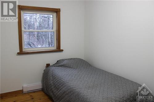 This 2nd bedroom is at the front of the house. - 4220 Hwy 511 Highway, Lanark, ON - Indoor Photo Showing Bedroom